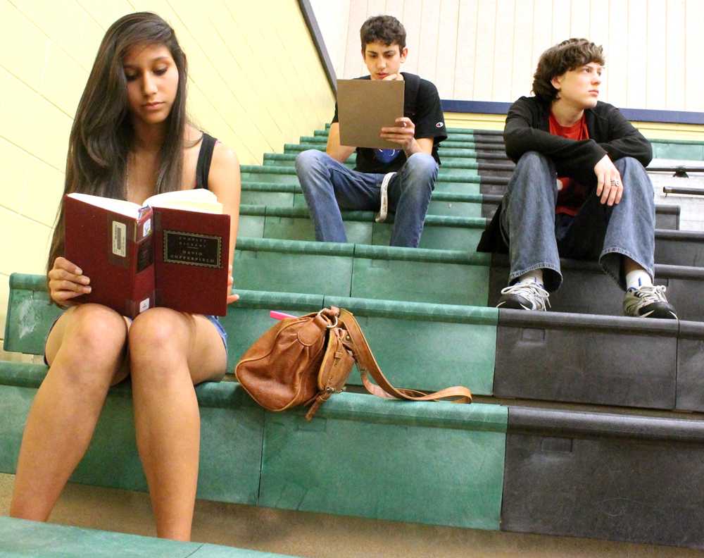 Students in Coach Jane Martin’s 8th period gym class read for 15 minutes at the start of class. The students have to read for at least 15 minutes before they dress out and participate in physical activities.