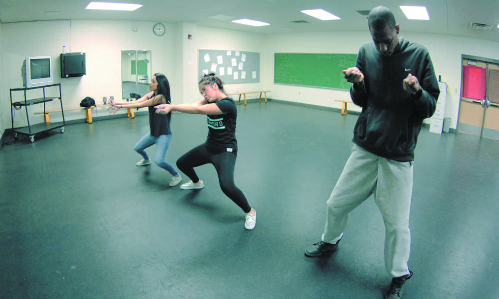  Following his moves, junior Angelica Castelan and former graduate Claudia Gonzalez practice with junior Daniel Broxton in the gym dance room after school. Broxton began teaching hip-hop classes this year and is a dance aid for Tonya Kallefelz’s dance one class. Broxton will also be collaborating with the Diamond Dazzlers for the annual Spring Show. 