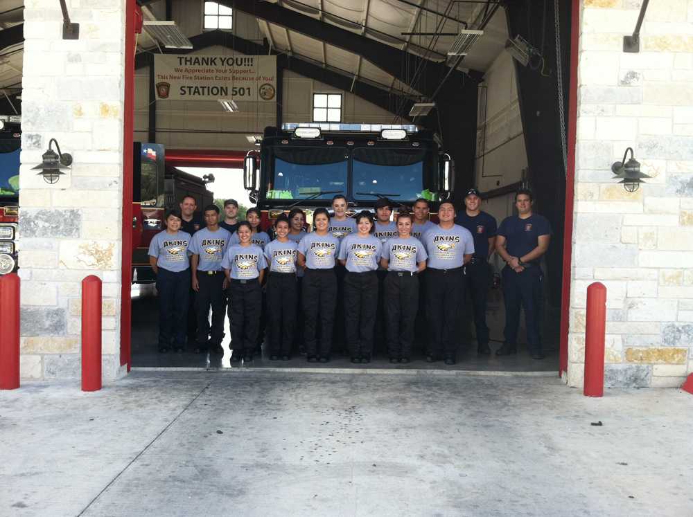 ECOM students pose in front of Manchaca fire station after a tour of the facility. Students learned procedures and got to interact with the technology needed. 