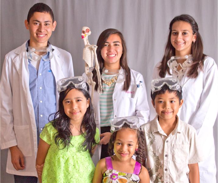Students from the Bio-medical program pose with children from various elementary schools. The campaign benefits new students to learn about the opportunities Akins offers.