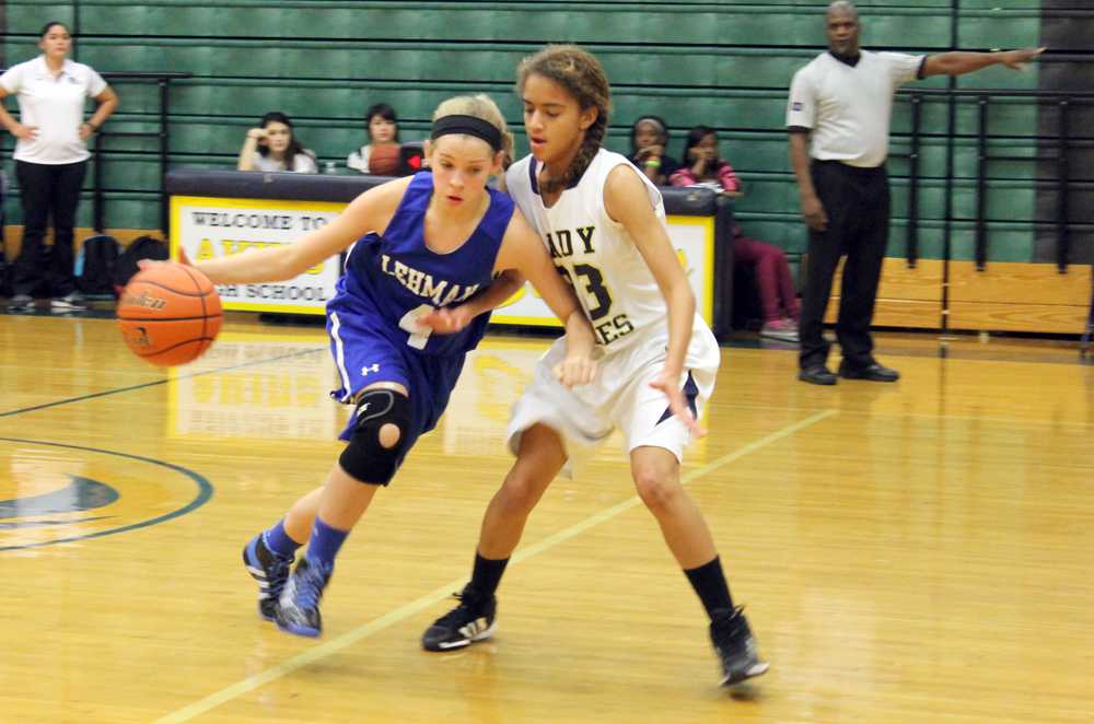 Sopohmore guard Brooklyn Childers defends a Lehman offensive guard. The Lady Eagles lost to Lehman.