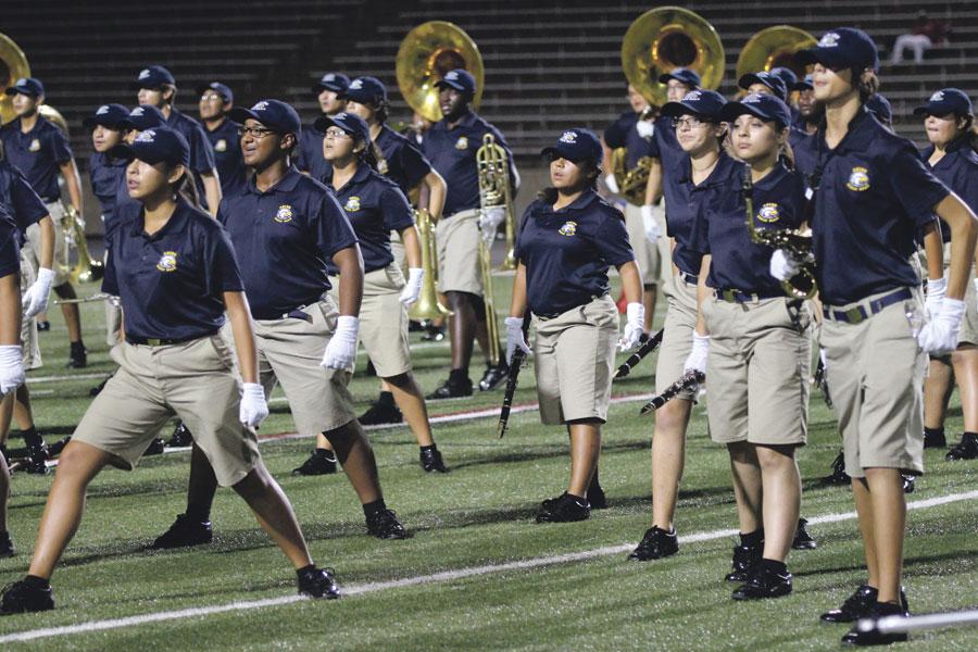 The band students giving it their all as one. Together, they add more movement to their performances and strive for the best.