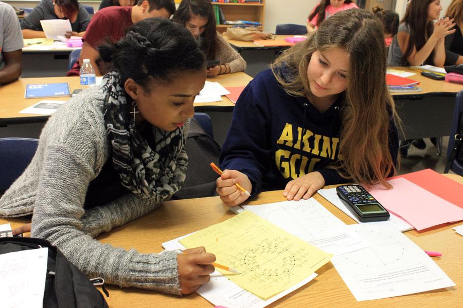 Maelle Baffert works on problems with a partner in Algebra 2 class. 