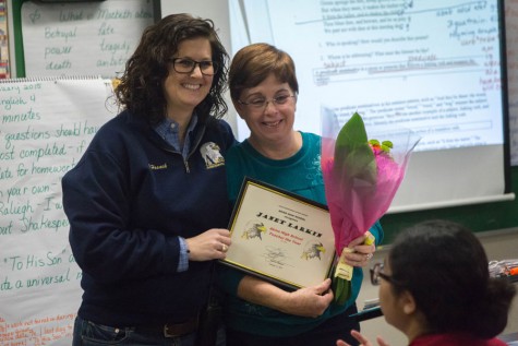 English teacher Janet Larkin receives her award for 2014-2015 Teacher of the Year.