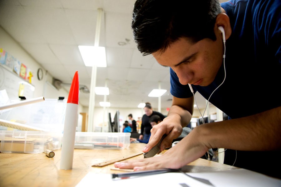  ▲ Rocket scientist at work
Senior Hector Gonzalez cuts a fin for his rocket. Gonzalez, a first year rocket student, designed the rocket himself and enjoys the class beacuse they don’t just learn about the rockets but get to try them out first hand.