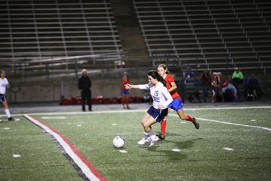 Sophomore Valerie Marquez takes a long run against Hays High School. The team fell 6 to 1 against Hays