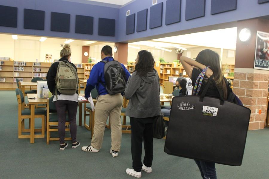 Students prepare to sign in for a three-hour long Saturday School session in the library.