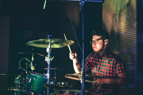 Senior Roy Cisneros drums along at a live performance in San Antonio, Texas with his fellow band mates  at a concert. This was their first huge gig where they sold band merchandise