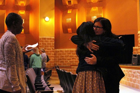 Principal Brandi Hosack hugs a faculty member during the Tuesday morning announcement meeting.