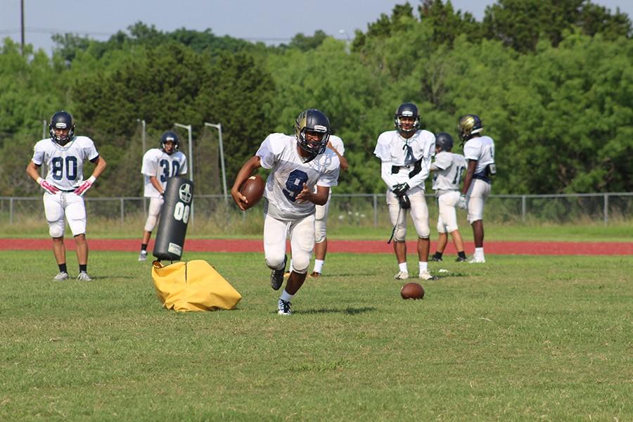 Sophomore Kenan Lockhart sprints down the field during an after school practice.