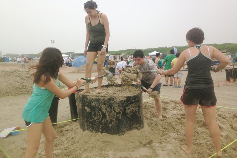 Students create the foundation for their UFO sand sculpture at the annual Port Aransas Texas Sandfest in April.