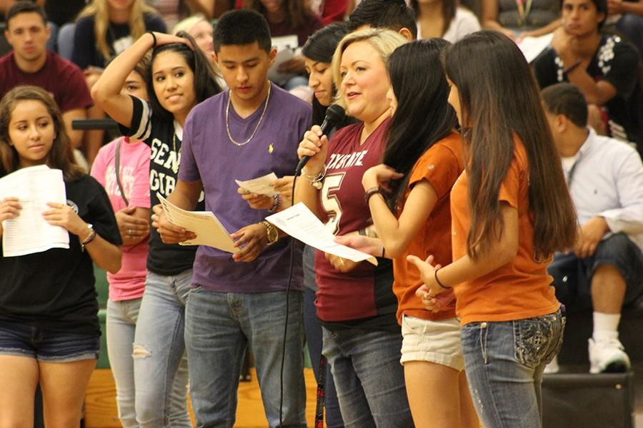 College and career counselor, Sarah Simmons, leads Akins students in a commitment pledge during an all day college prep event on Friday.