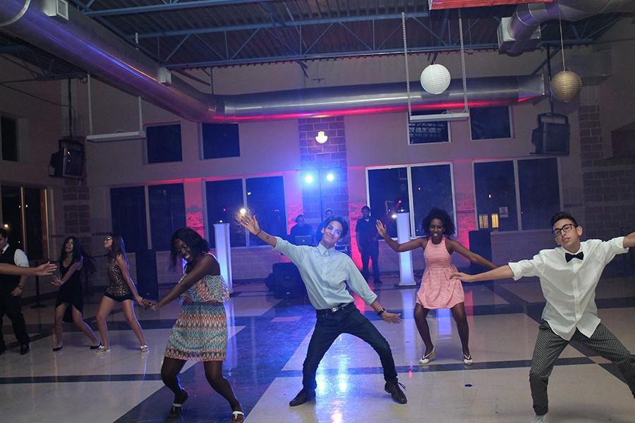 Students dance to the new hit song, Hit the Quan, by iHeart Memphis at the Akins Homecoming dance. The song was a big hit, along with Watch Me (Whip/ Nae Nae) by Silento. 