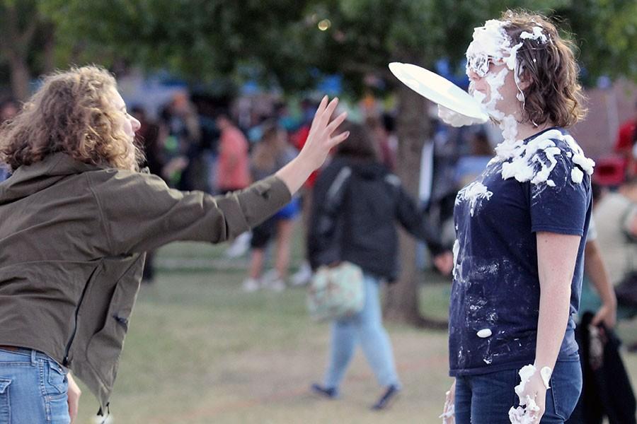 Akins teacher Catherine Ballard receives a pie to the face at the pie throwing booth
run and organized by the Akins Choir.