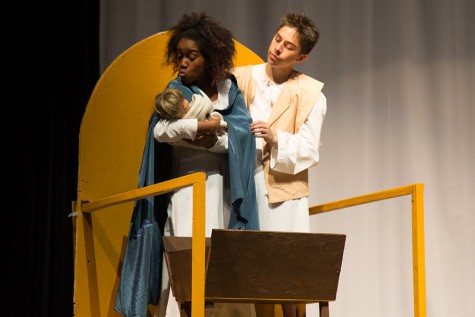 Senior Tyra Williams and freshman Jonathan Mecedo hold an infant Jesus in The Best Christmas Pageant Ever!, which is just one of several winter fine arts performances going on.