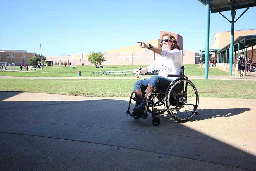 Principal Brandi Hosack enjoys her time participating in the very first Wheelchair Challenge. Hosack does her usual patrol of the cafeteria area, while enjoying other staff.