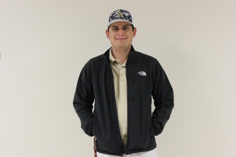 Coach Thomas Norris, poses for a picture as Akins official golf coach. Norris is a Texas history at Paredes Middle School.