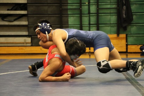 The Akins wrestling team faces opponents against Travis High school. Both girls and boys wrestling teams wrestled the day of
the match. Representing the team for girls is Brenda Cacino and for the boys, Robert Rodrigez and Daisy Tapia.