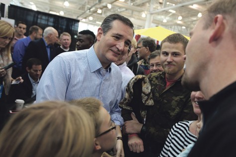U.S. Senator Ted Cruz, R-Texas, speaking with supporter at a campaign rally featuring Gov. Rick Perry at Noahs Event Center in West Des Moines, Iowa.
