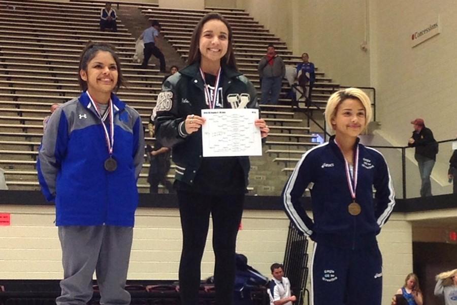 Freshman wrestler Leslie Mejias (right) took home 3rd Place at the regional UIL tournament in San Antonio in February.