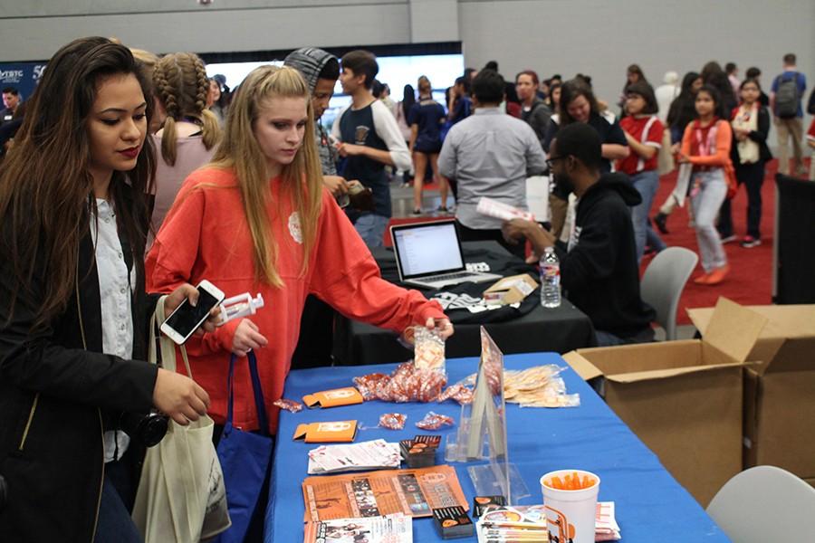 Students participate in a booth about the performing arts.