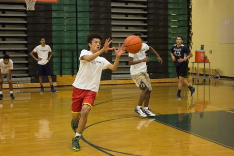 Sophomore Isaiah Landers catches a pass during a practice session for the new Eagles AAU Select team, which players hope will prepare them for next year. The team is being coached by seniors Leroy Bryant and Donald Akers.