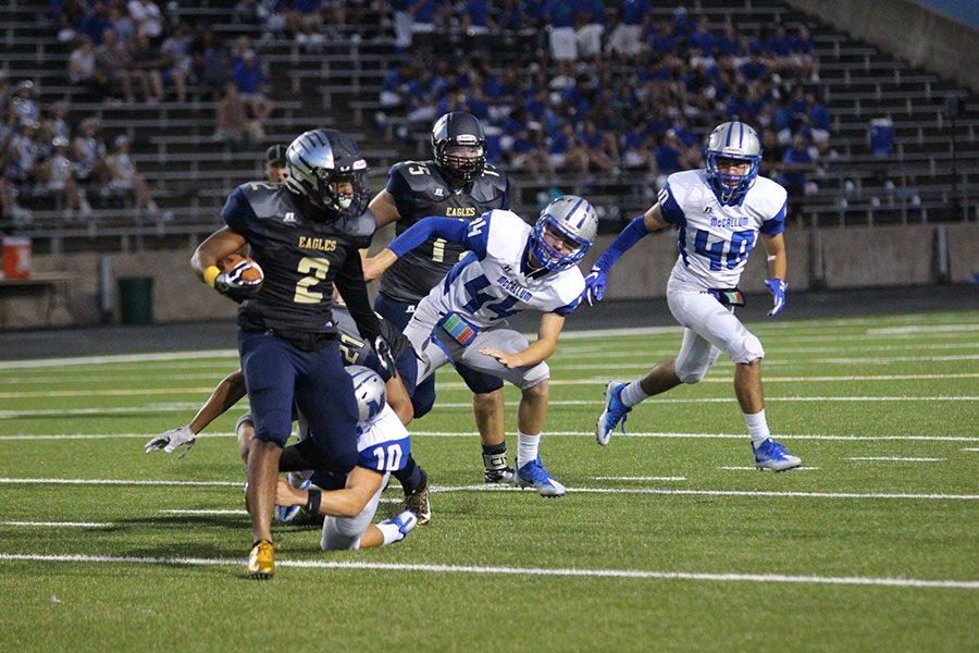 Running back Keenan Lockhart evades a defenders tackle in a game
against the McCallum Knights. Akins lost this game 17-7.