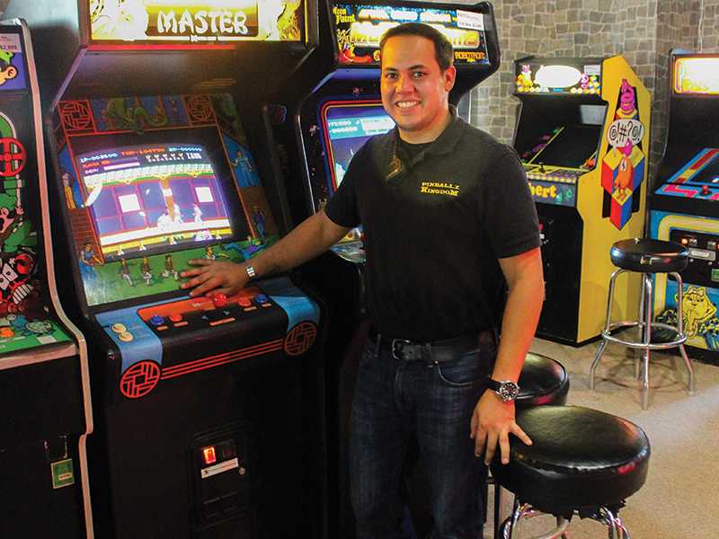 Jeremy Mendoza manager at Pinballz Kingdom shows off his favorite game from his childhood