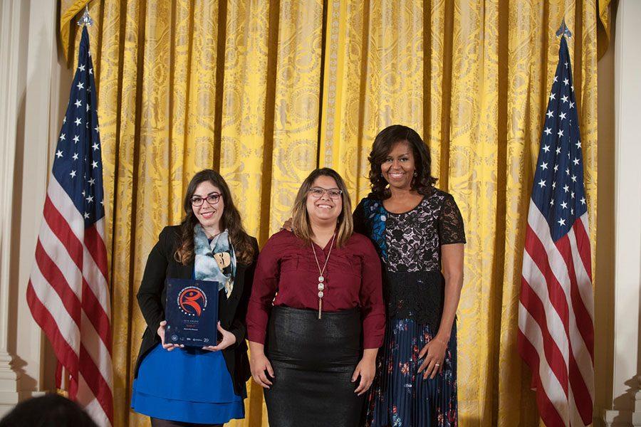 Akins alumna Kassey Rocha (middle) and Olivia Tamzarian receive award from the First Lady Michelle Obama at the White House in November. The award recognized Mexic-Arte Museums Screen It! after school program.
