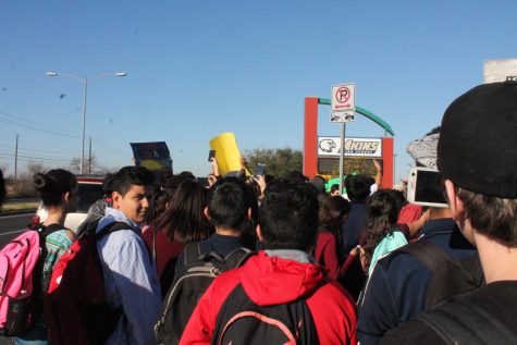 More than 100 students walked out of classes at 4 p.m. and protested at the front of the campus on Feb. 1 surrounding the schools marquee. Administrators and police monitored the protest as students marched down S. First St. and then circled the outside of the school.