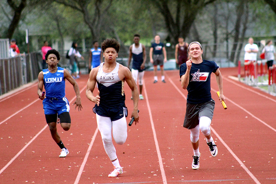Junior Malcom Rogers runs for the finish line
at a Hays Track meet in April. Rogers advanced to area after placing sixth at the district meet with a time of 11.55 in the 100m dash.
