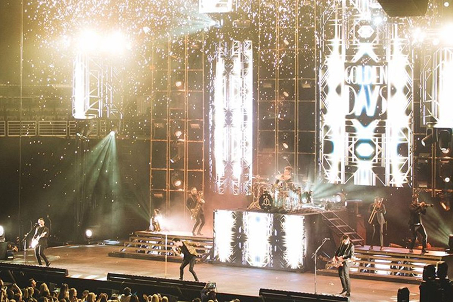 Members of Panic! at the Disco perform on stage at the Frank Erwin Center.