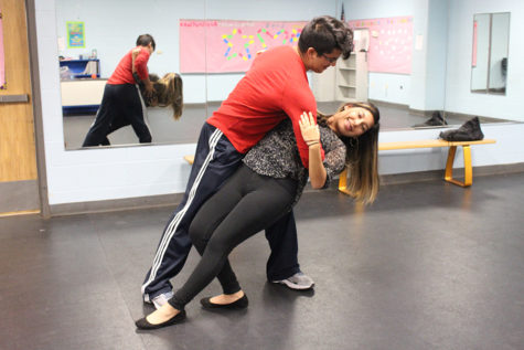 Junior Jose Gonzales dips his partner junior
Rachel Rivera when rehearsing for their weekly
class. 