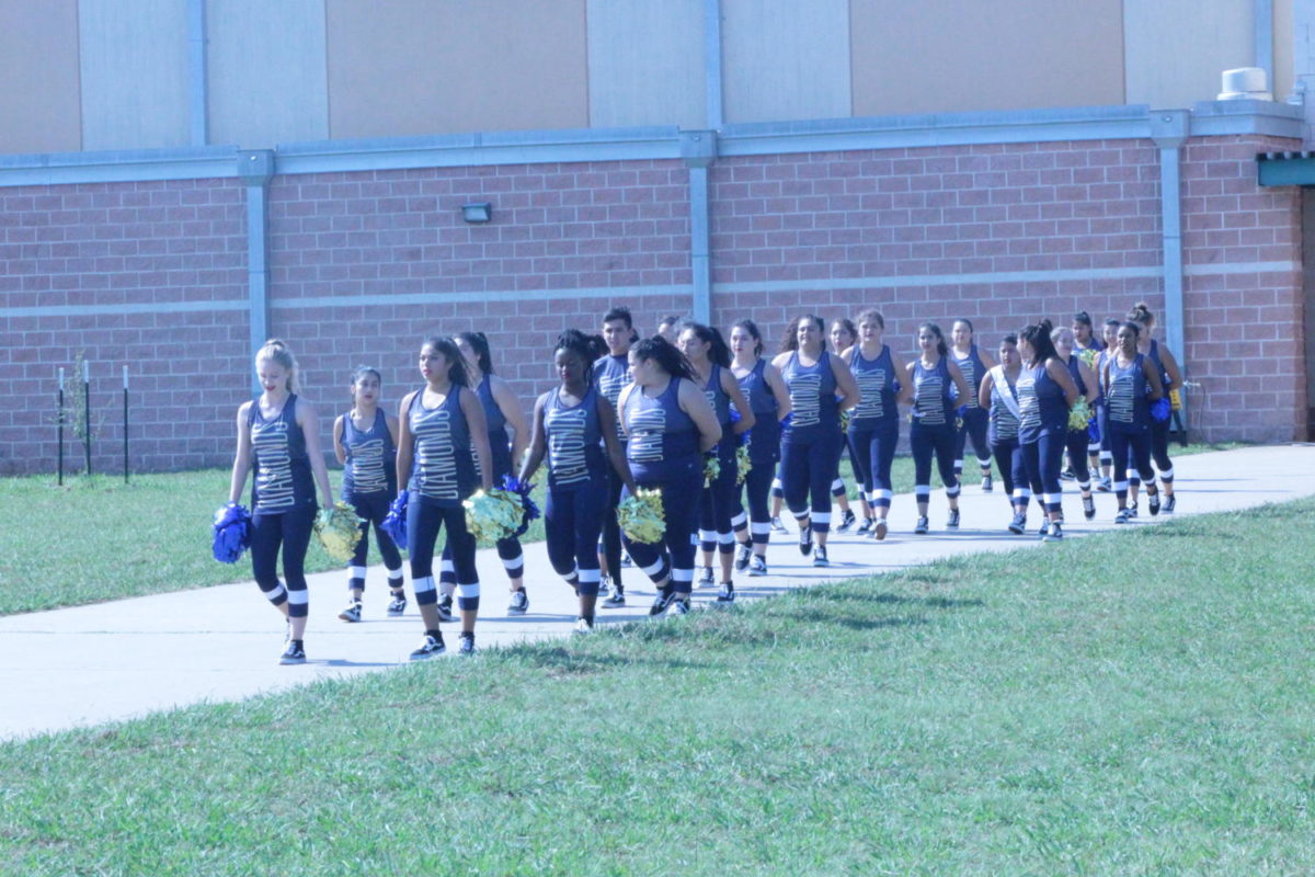 Diamonds Dazzlers start walking towards the courtyard to put on performance at the pep rally.