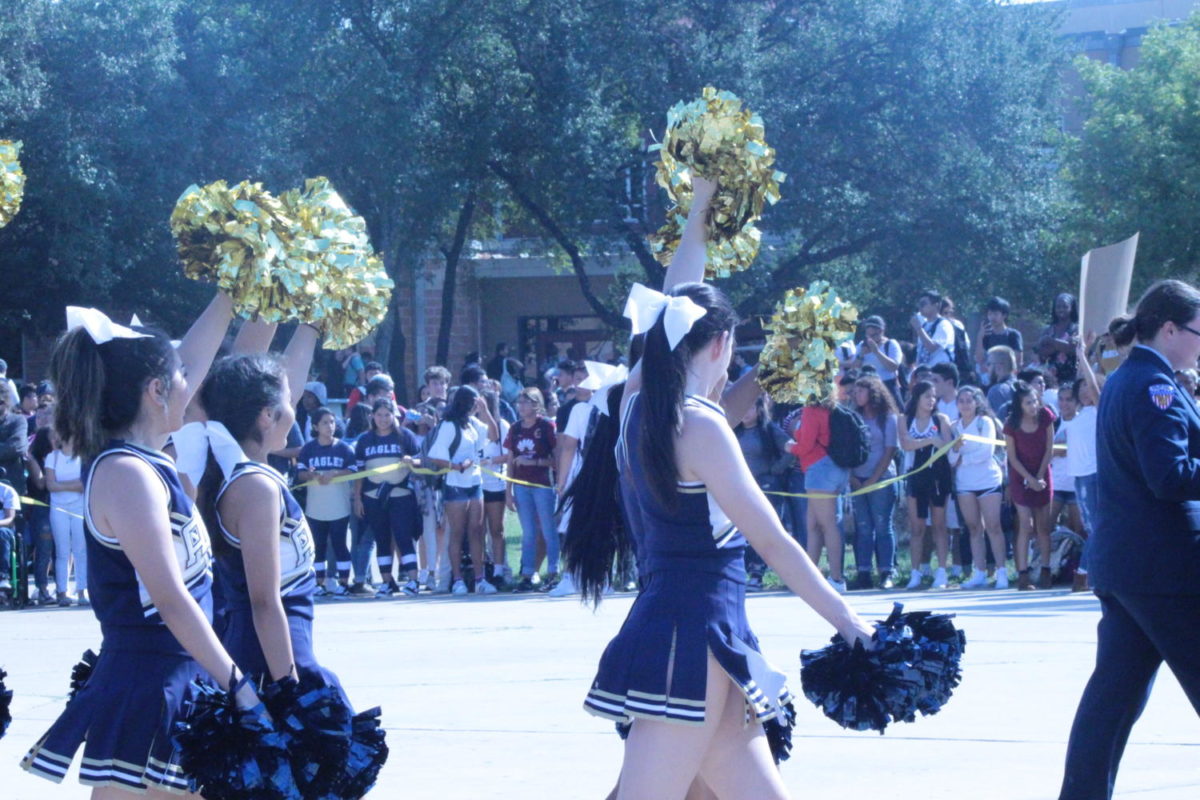 Akins Cheerleaders arrive to the courtyard to rally the crowd to defeat the Lehman Lobos.
