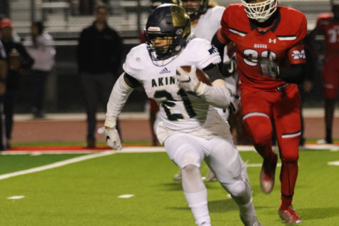 Malcom Rodgers runs for a play against the Manor Mustangs during the final regular season game. The Eagles beat the Mustangs that night in the final seconds of the game, earning the Akins football team their second appearance in district playoffs in school history.
