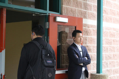 Assistant principal  Michael Jung monitors students as they enter the STEM wing before school starts. Administrators and security personnel were seen in greater numbers after the lockdown event in February.