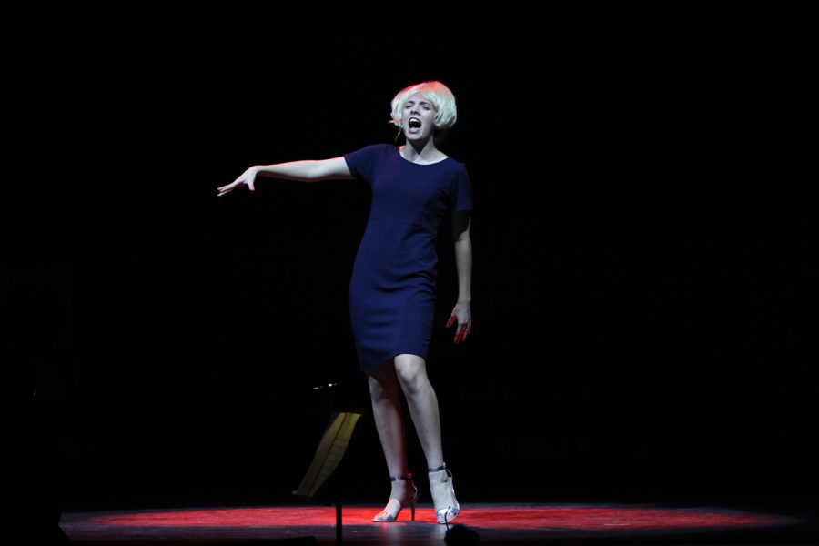 Freshman Coral Rolon stars as the antagonist Velma von Tussle in Hairspray, singing her part on stage.