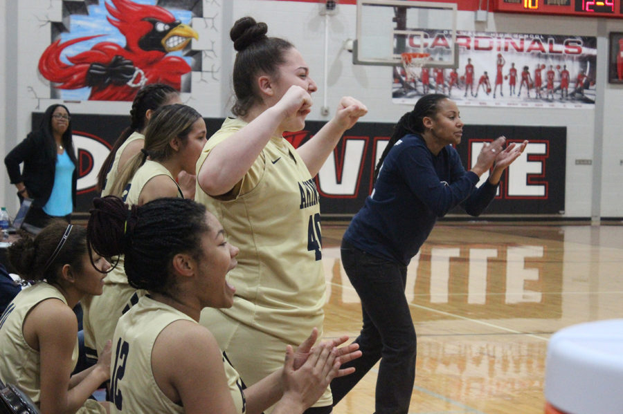 Freshman+Melanie+Cantu+cheers+on+her+team+in+a+game+against+Del+Valle.+Akins+beat+Del+Valle+57-51+sweeping+them+for+the+season.