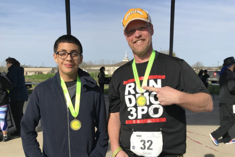 Yearbook teacher Sean Claes congratulates freshman Jordyn Aguilar for beating his time in the SoChac 5K race. Claes boasted that he was the Fastest Person at Akins to encourage Akins staff and students to participate in the race, which benefits Akins High, Paredes Middle and Menchaca Elementary schools.