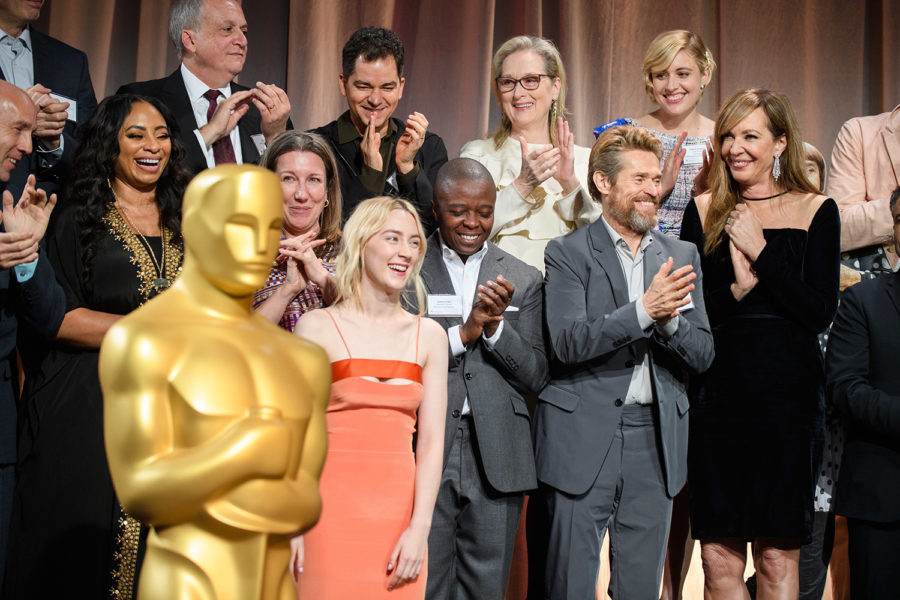Oscar nominees gather for a group photo at a luncheon.