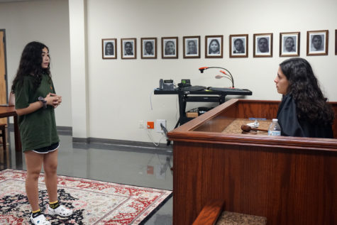 Sophomores Amarye Tovar and Coral Rolon practice their mock trial routine before district competitions in the fall. Students practice their routines repeatedly to perfect their skills in courtroom procedure and questioning witnesses.