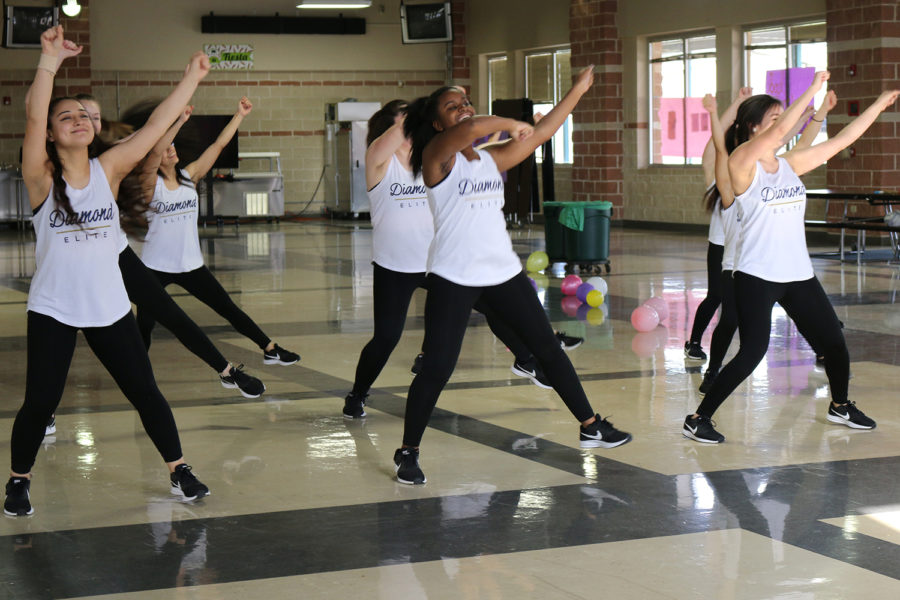 Diamond Dazzlers perform in the cafeteria for the AkinsTHON fundraising event.
