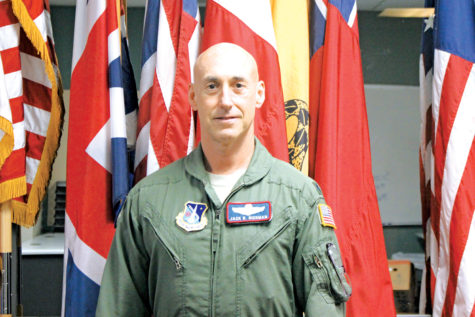 Colonel Jack R. Rickman, a command pilot with 3200 total  ying hours uses his experiences to help the AFJROTC program. Col. Rickman recounts his past missions, like having to land a C-5, a large military transport aircraft, with the nose gear retracted and a nearly empty fuel tank with 50 passengers on board. 