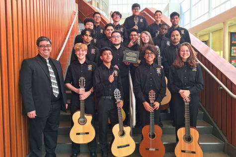 Students in the advanced guitar class celebrate winning a “professional sweepstakes” award at the University Interscholastic League’s competition. Both the advanced students and the beginning students won sweepstakes in Classical Guitar Ensemble Concert and Sight Reading.