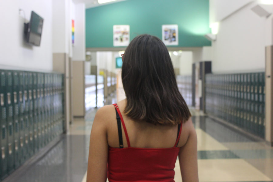 Students are often seen wearing spaghetti strap shirts, which are a violation of the current dress code.