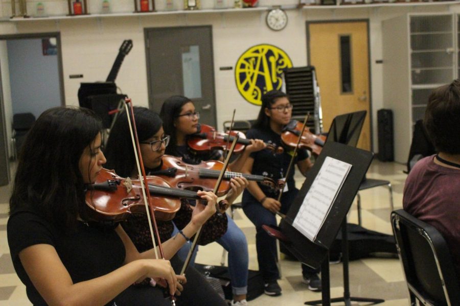 Students play violin as part of the Mariachi Club after school in the orchestra room. The club meets on Wednesdays starting at 4:30 p.m.