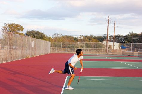 Practice Makes Perfect Senior Andy Doan practices his serve. Doan and the Akins Tennis team head into the spring season hoping to bounce back from a lackluster fall season