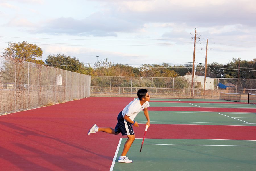 Practice Makes Perfect Senior Andy Doan practices his serve. Doan and the Akins Tennis team head into the spring season hoping to bounce back from a lackluster fall season