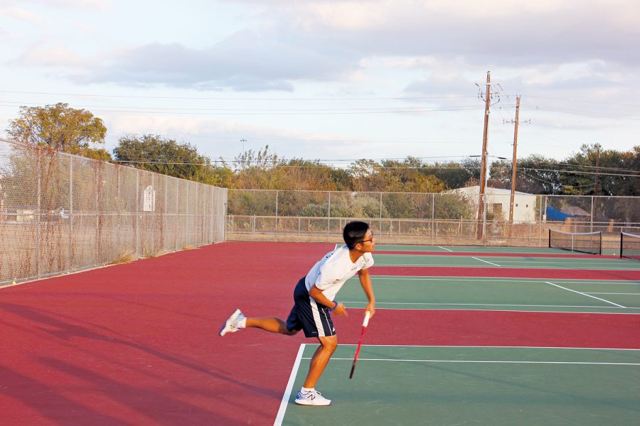 Practice+Makes+Perfect+Senior+Andy+Doan+practices+his+serve.+Doan+and+the+Akins+Tennis+team+head+into+the+spring+season+hoping+to+bounce+back+from+a+lackluster+fall+season